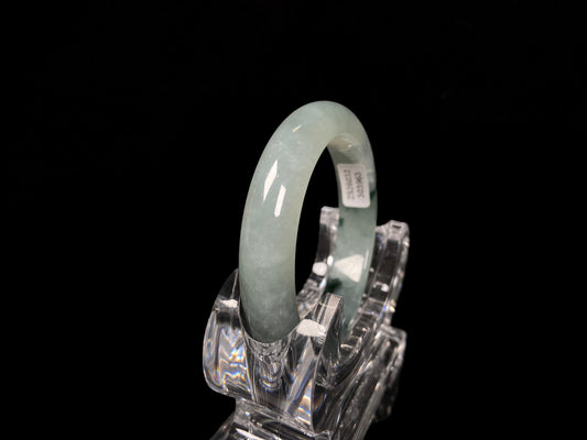 A moss green icy bloom jadeite bangle.