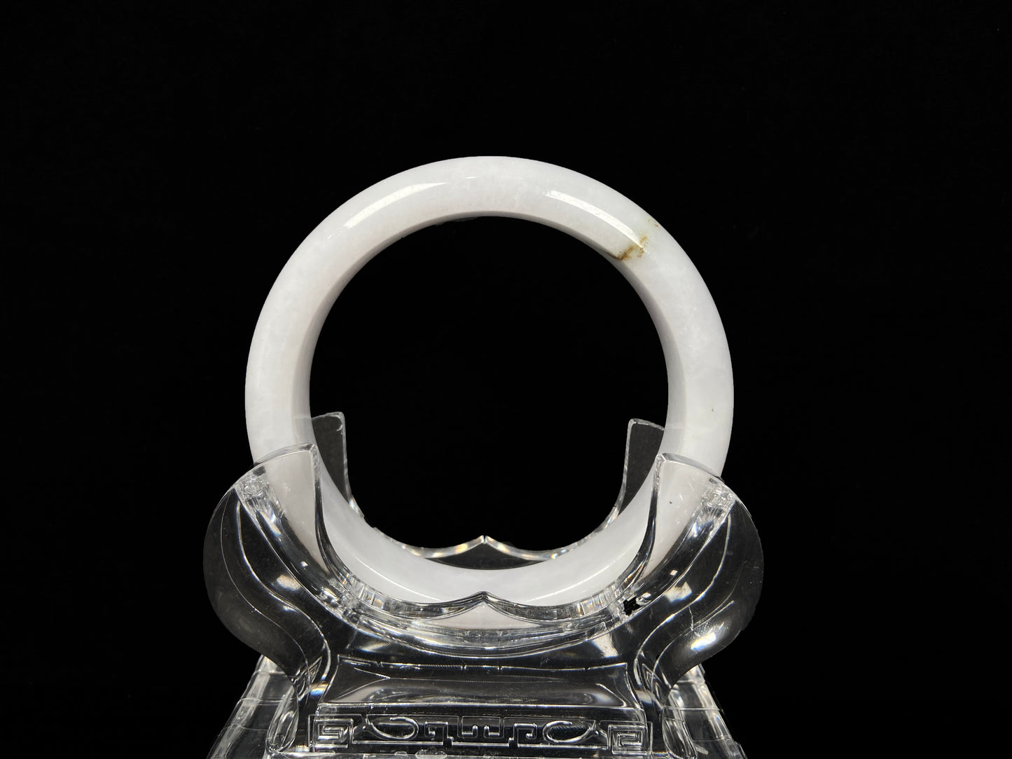 A milky white golden line jadeite bangle.