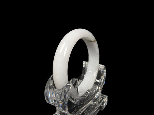 A milky white golden line jadeite bangle.