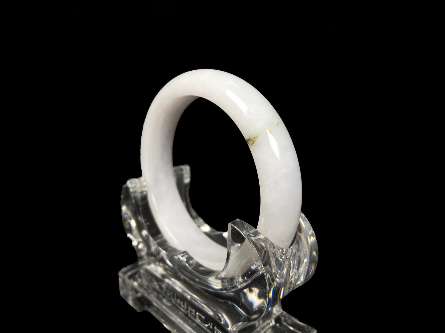A milky white golden line jadeite bangle.
