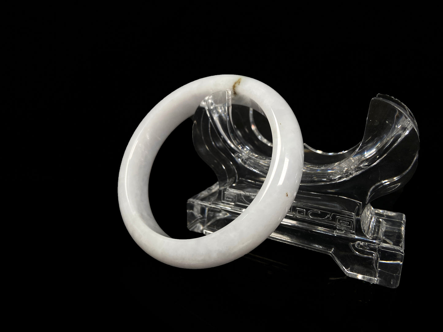 A milky white golden line jadeite bangle.
