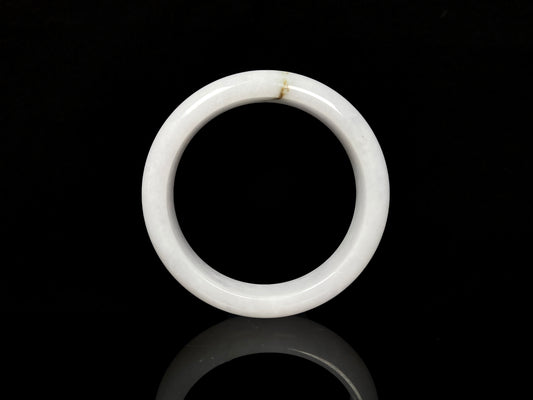 A milky white golden line jadeite bangle.
