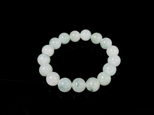 A translucent green with forest fleck  jadeite beads bracelet.