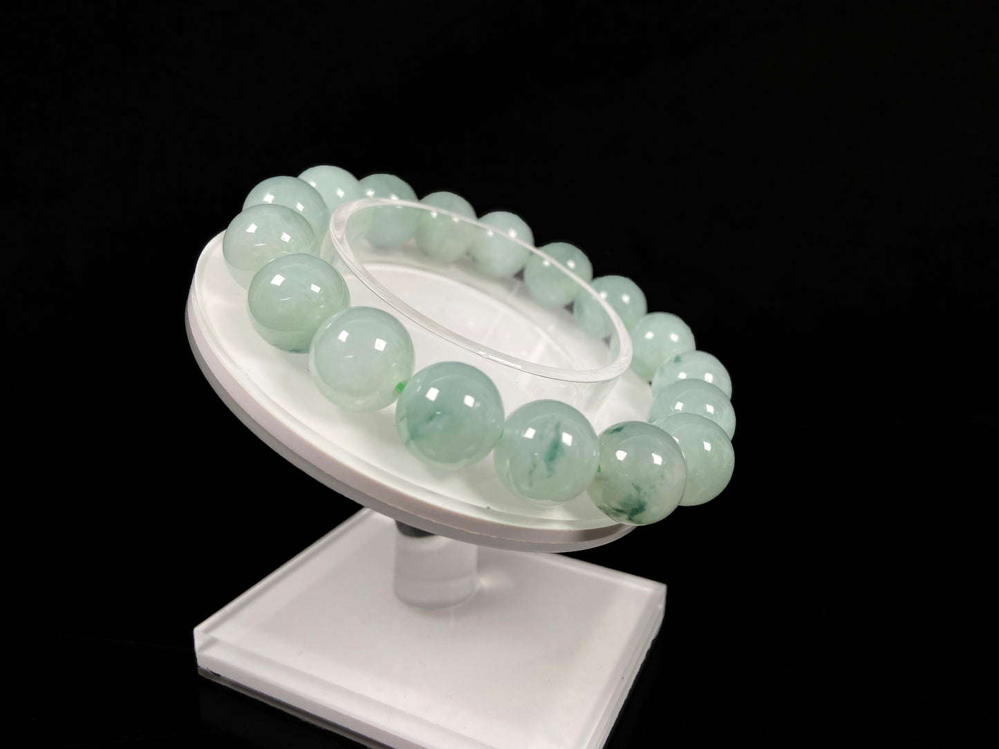 A translucent green with forest fleck  jadeite beads bracelet.