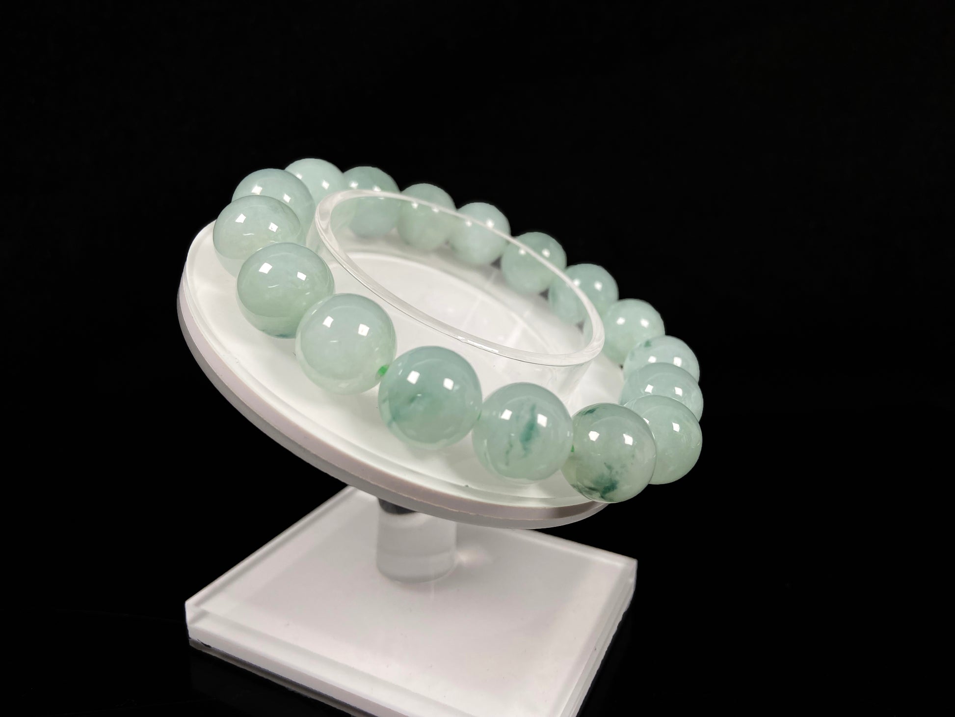 A translucent green with forest fleck  jadeite beads bracelet.