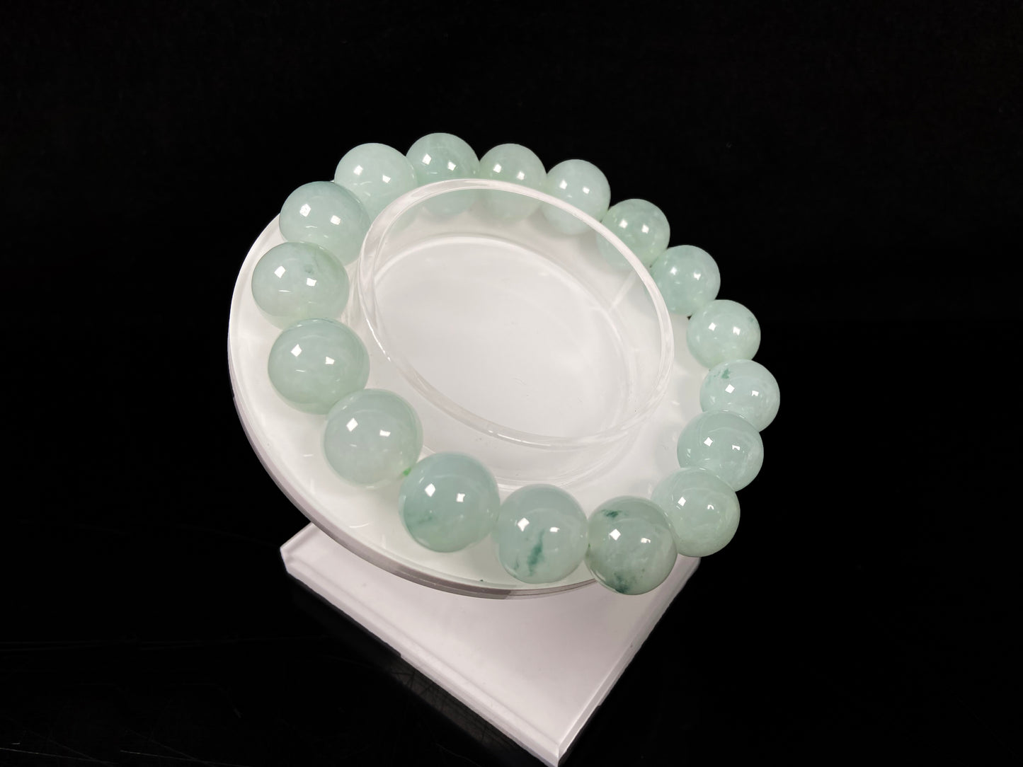 A translucent green with forest fleck  jadeite beads bracelet.
