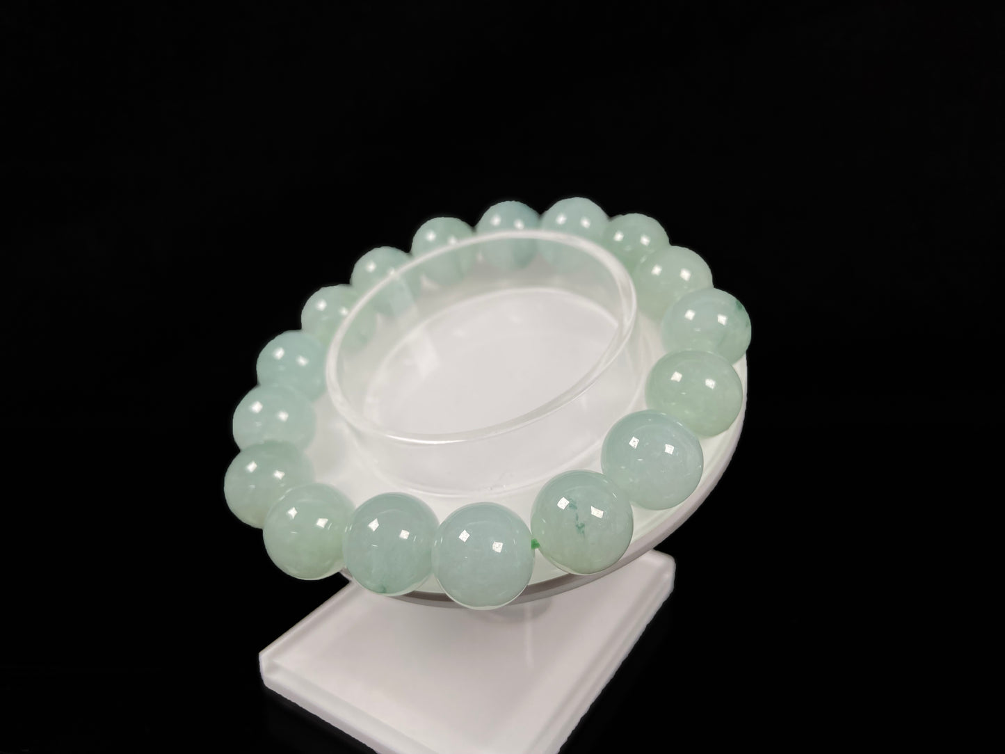 A translucent green with forest fleck  jadeite beads bracelet.