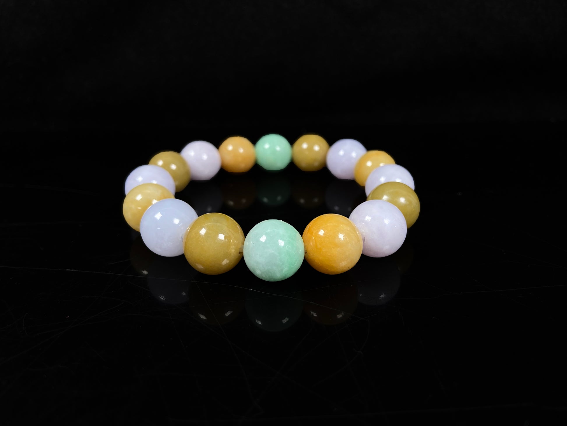 A yellow green purple jadeite beads bracelet.