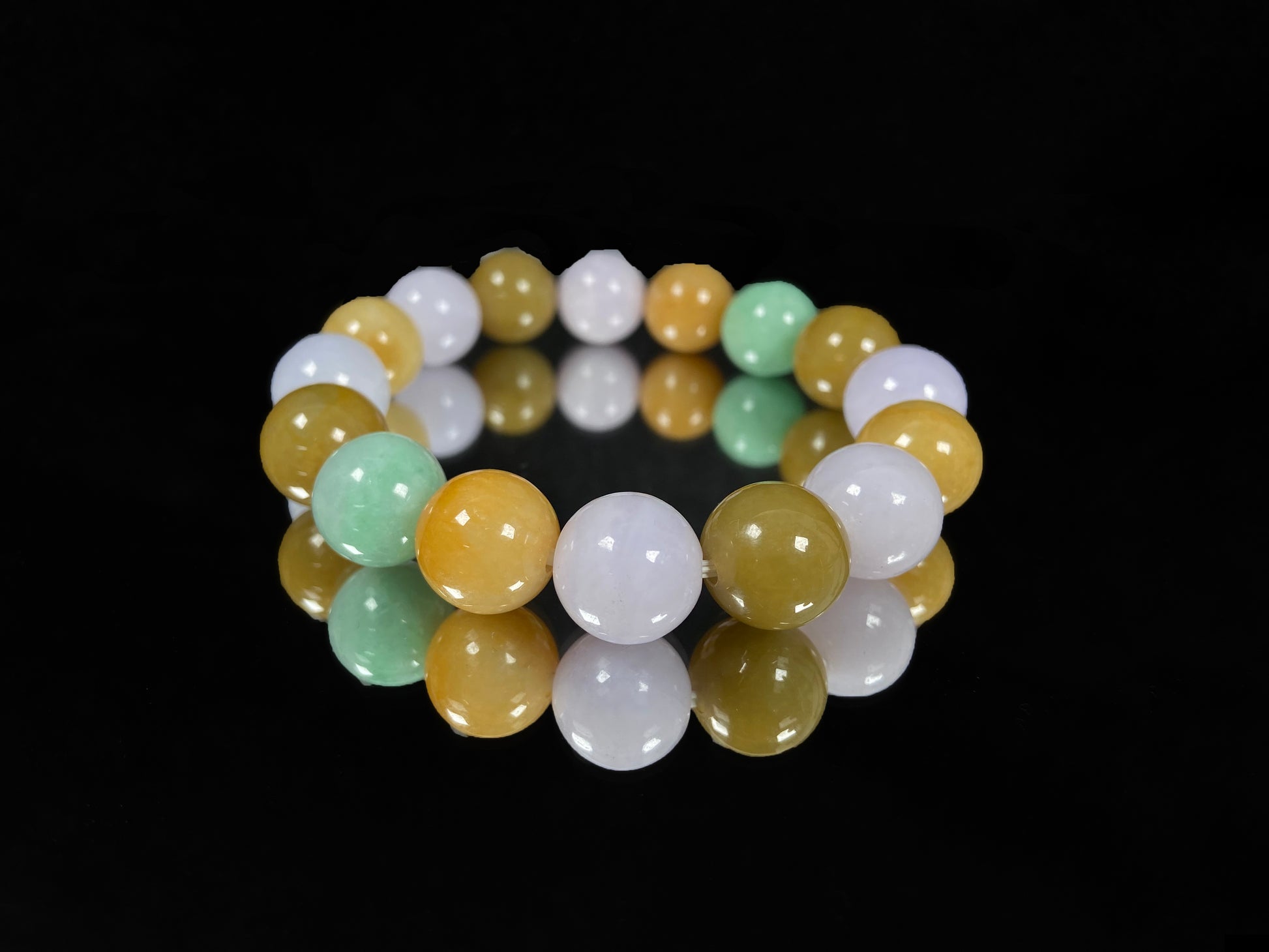 A yellow green purple jadeite beads bracelet.