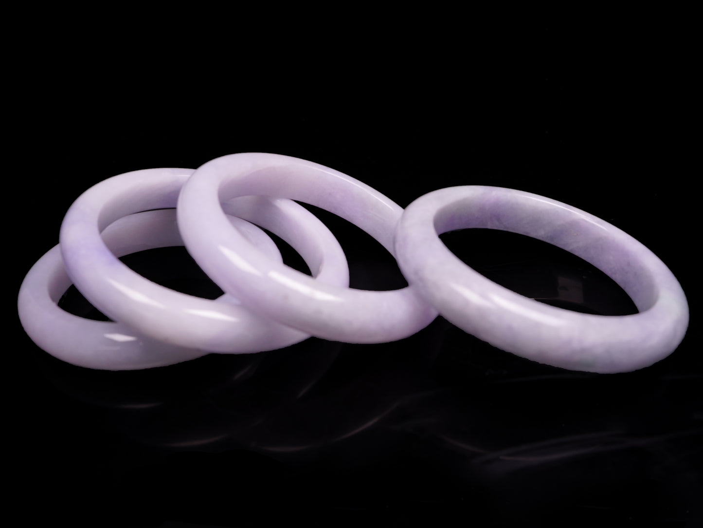 Lavender hues spreading jadeite bangle.
