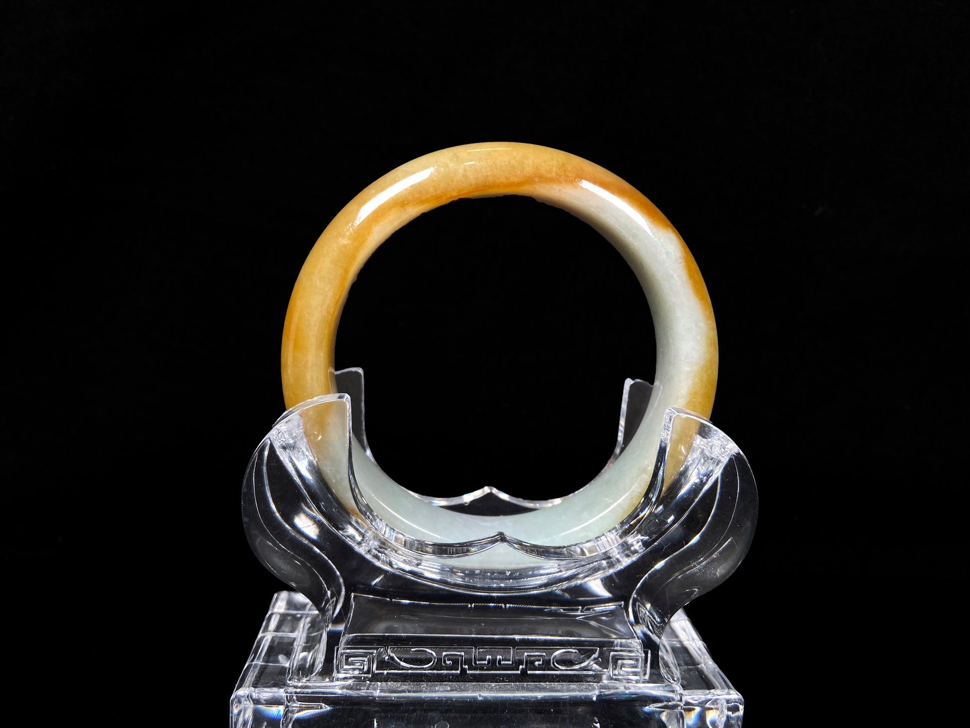 A honeyed frost jadeite bangle.