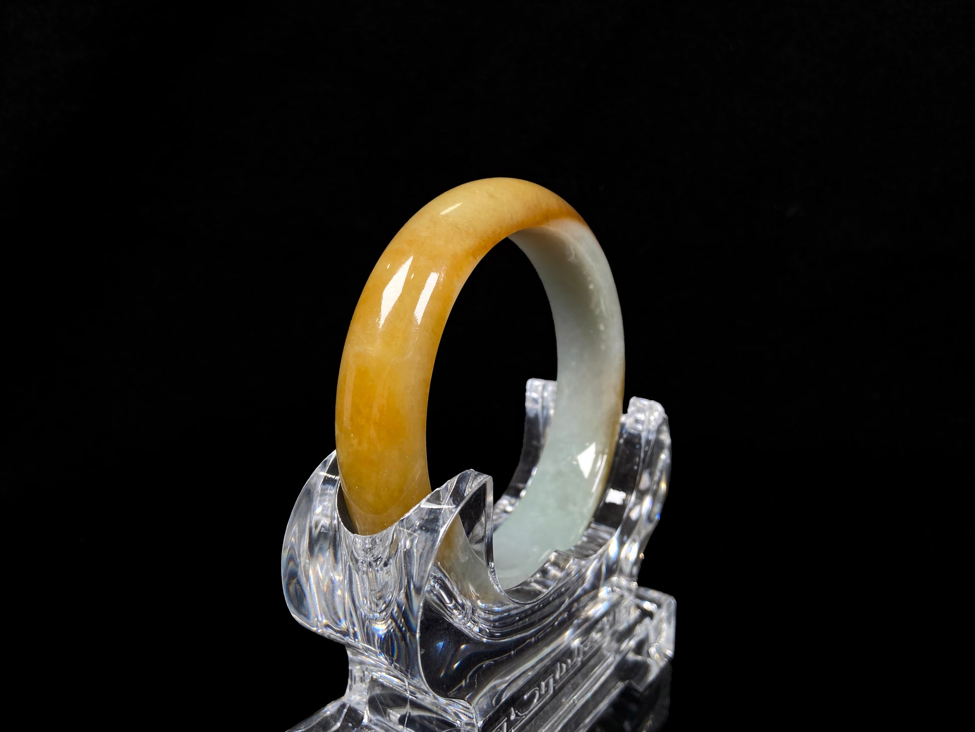 A honeyed frost jadeite bangle.