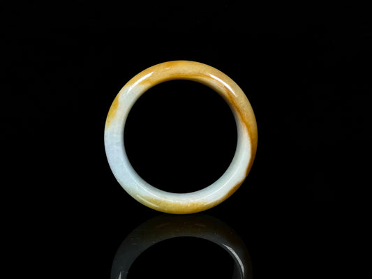 A honeyed frost jadeite bangle.