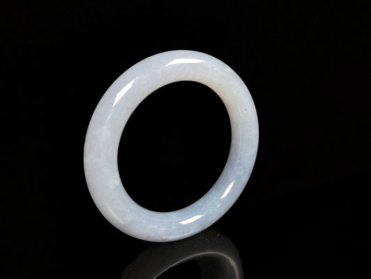 A moonlit white with pale blue jadeite bangle.