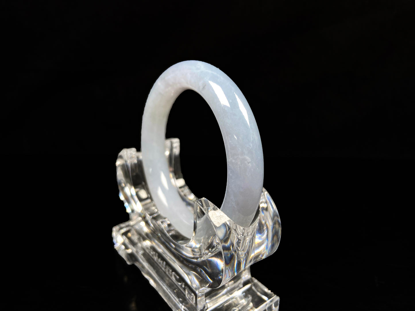 A moonlit white with pale blue jadeite bangle.