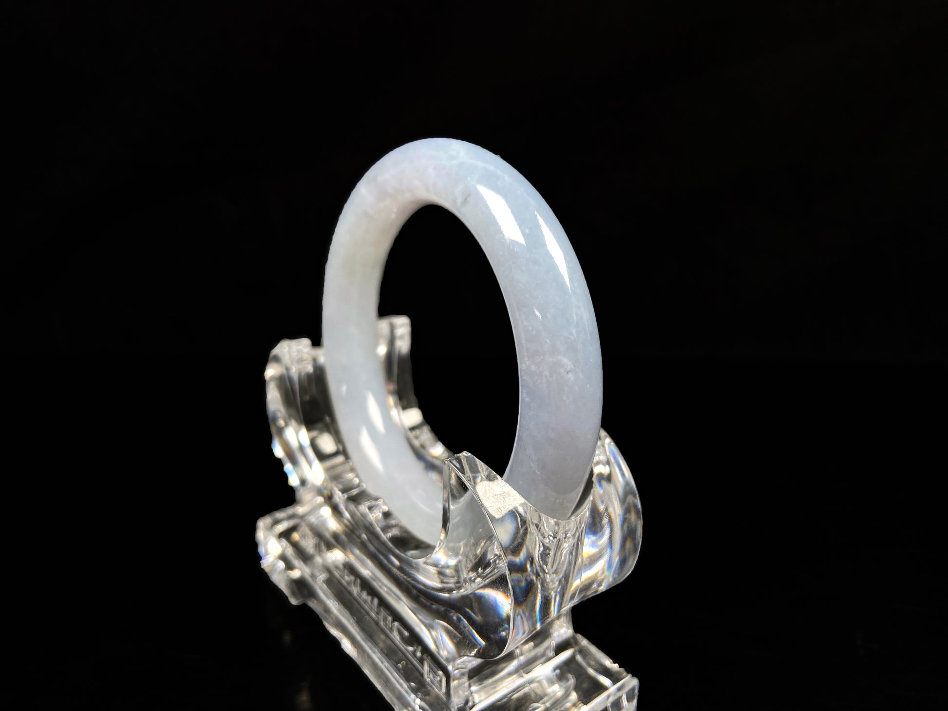 A moonlit white with pale blue jadeite bangle.