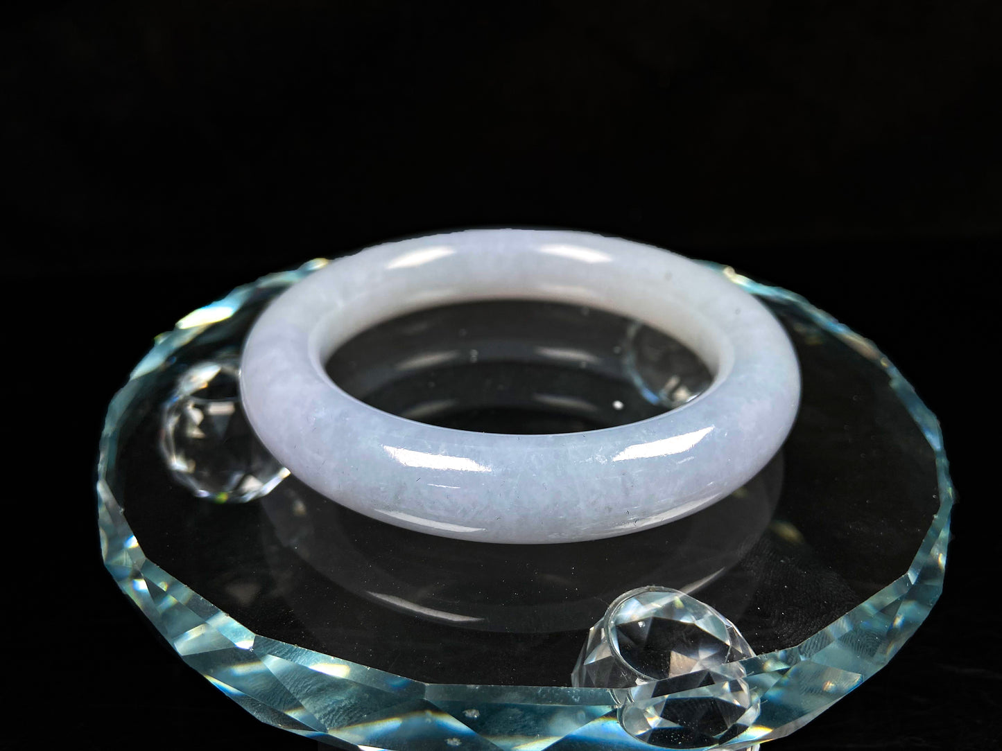 A moonlit white with pale blue jadeite bangle.