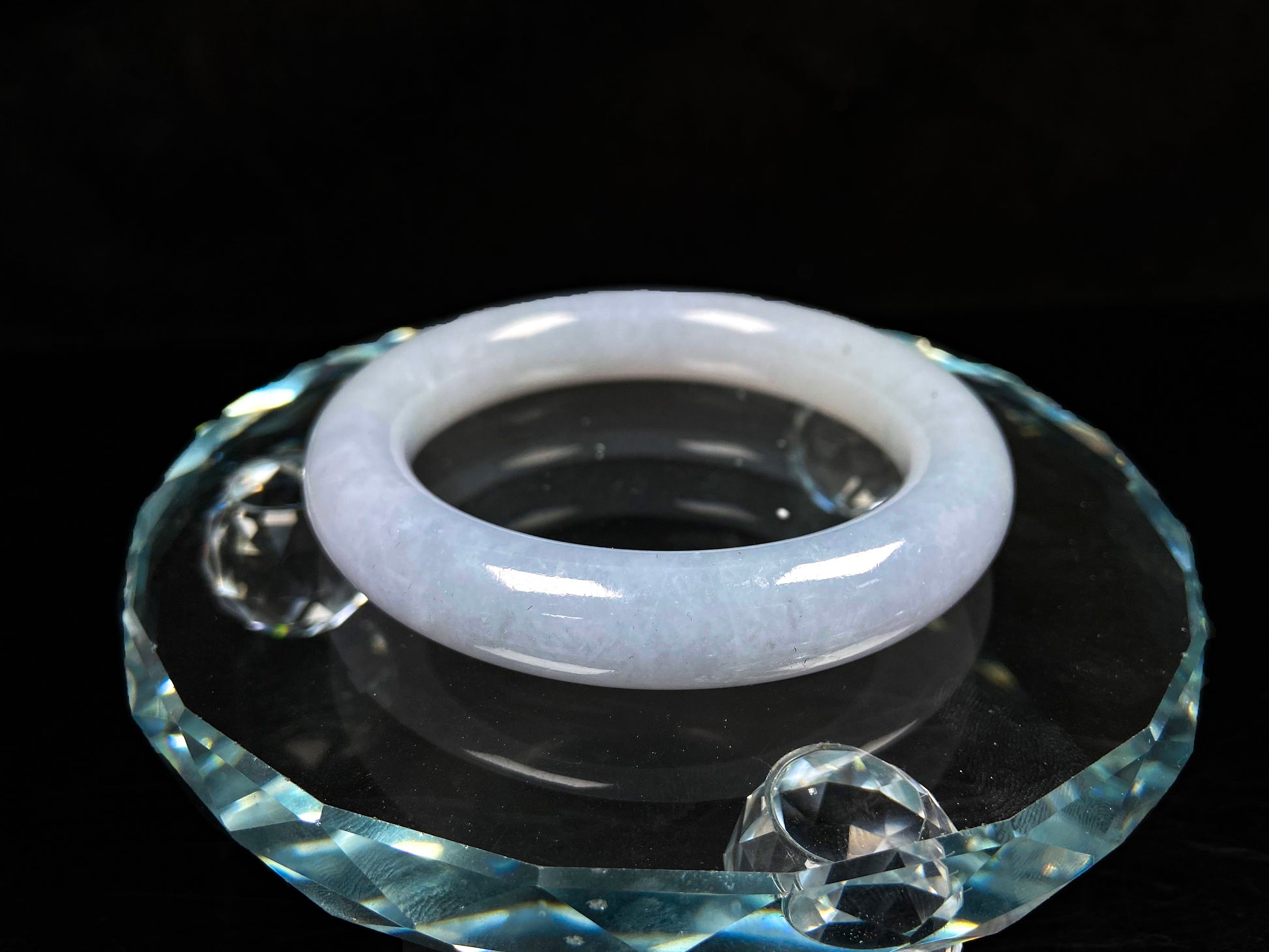A moonlit white with pale blue jadeite bangle.