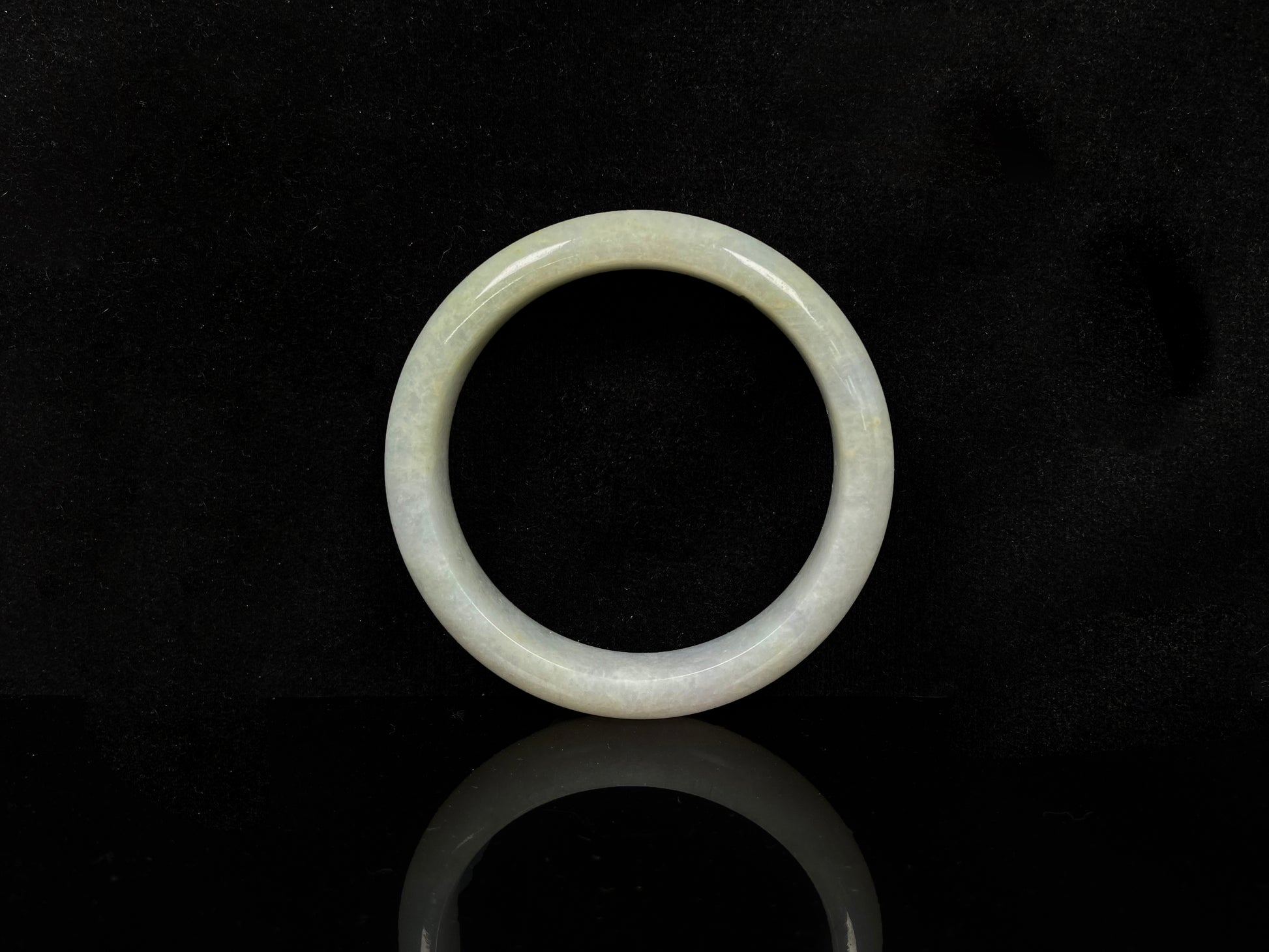 A willow bud green glow jadeite bangle.