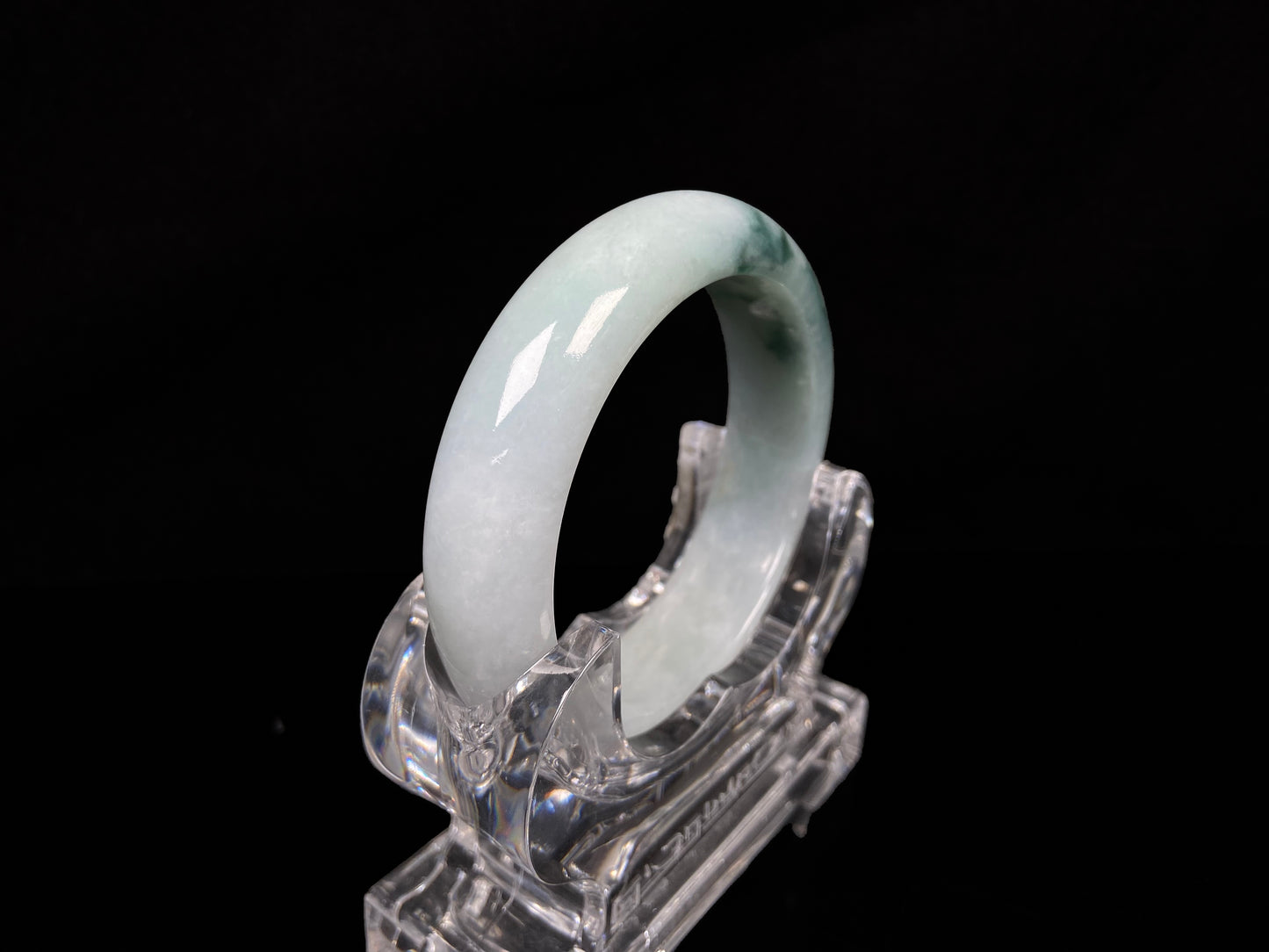 A blue green hues jadeite bangle.