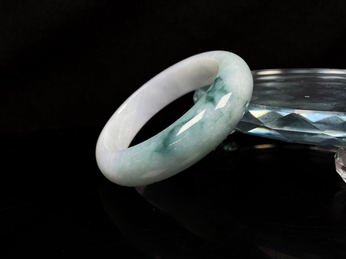 A blue green hues jadeite bangle.