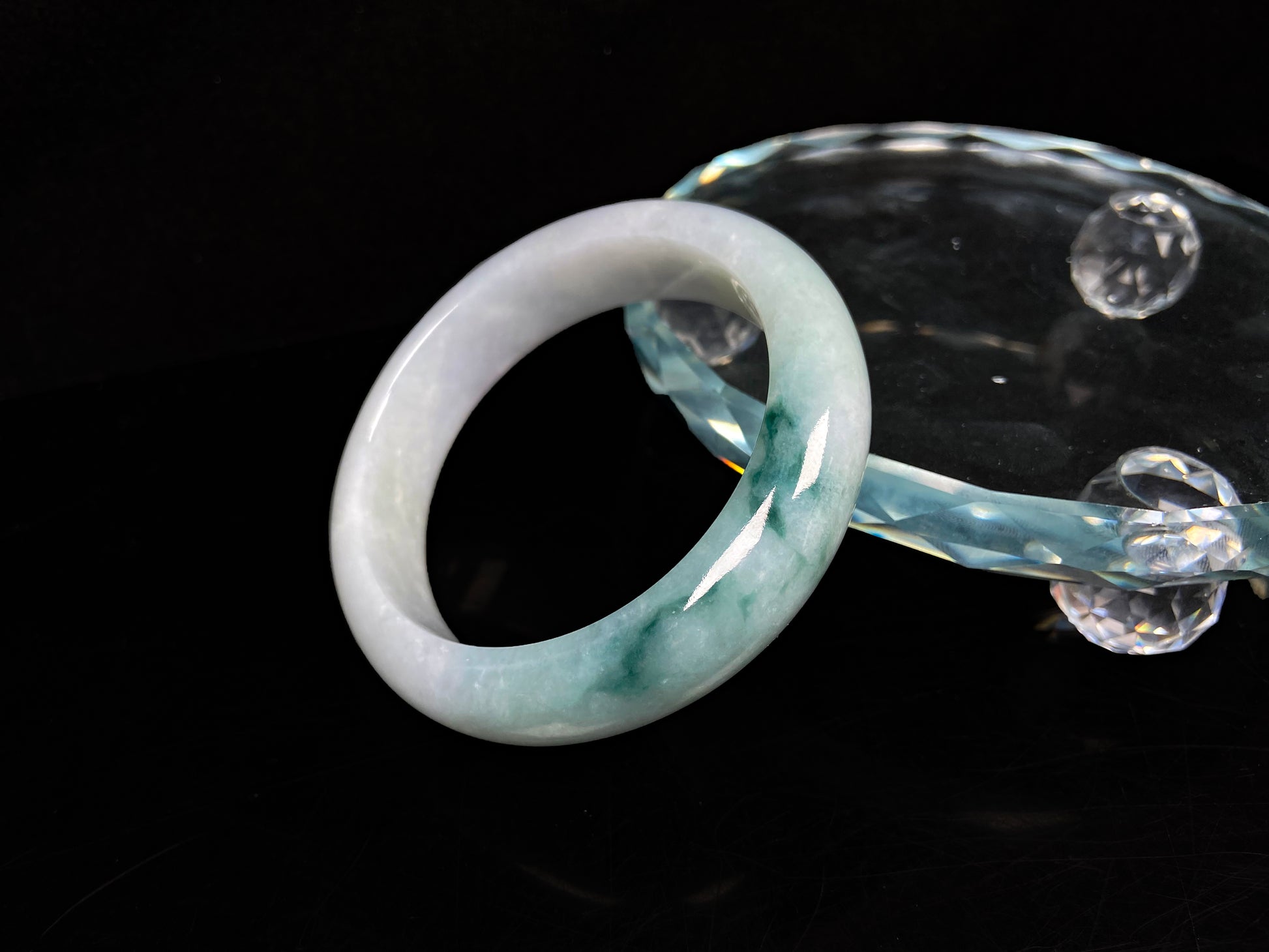 A blue green hues jadeite bangle.