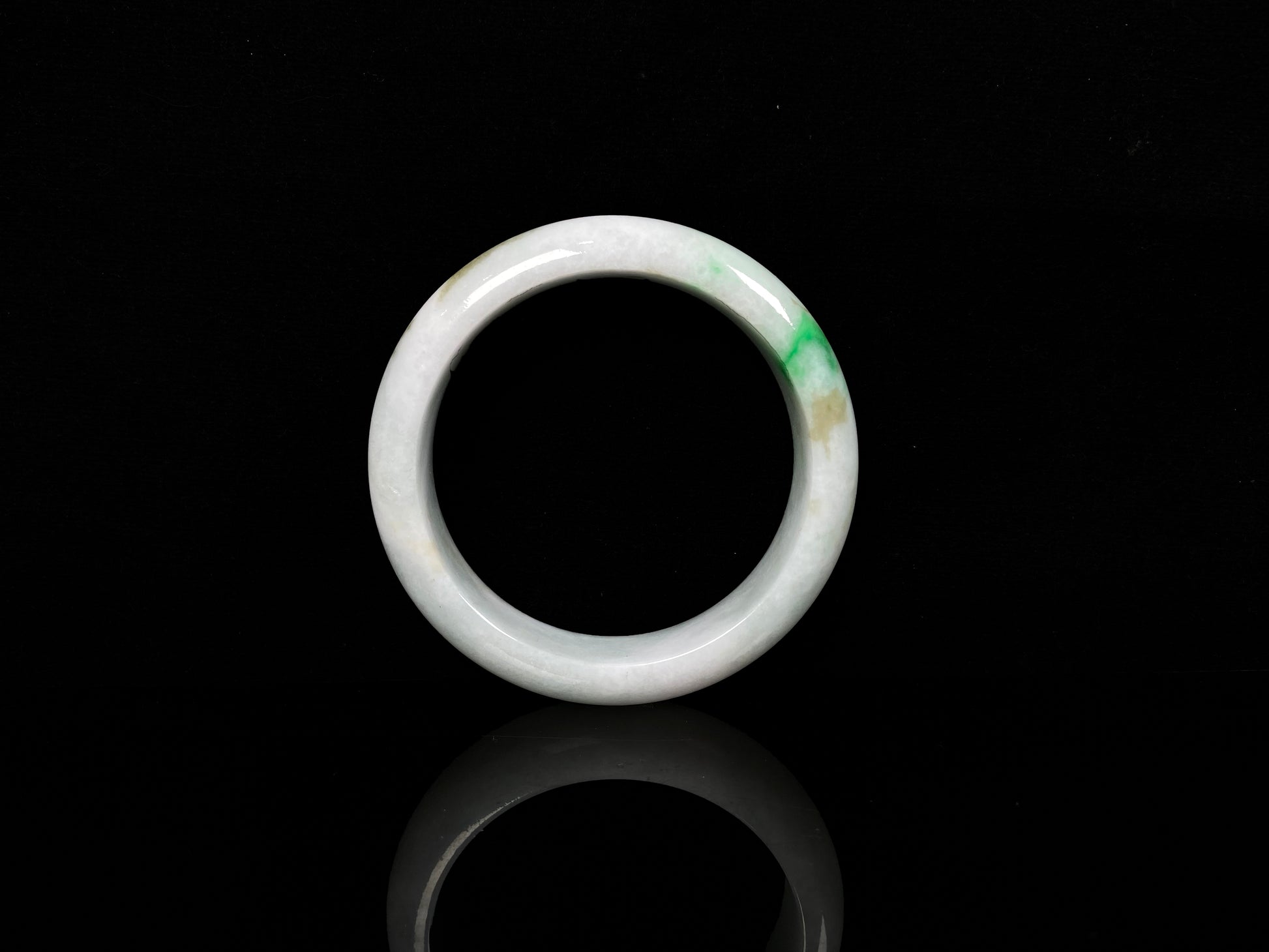 A green sprout jadeite bangle.