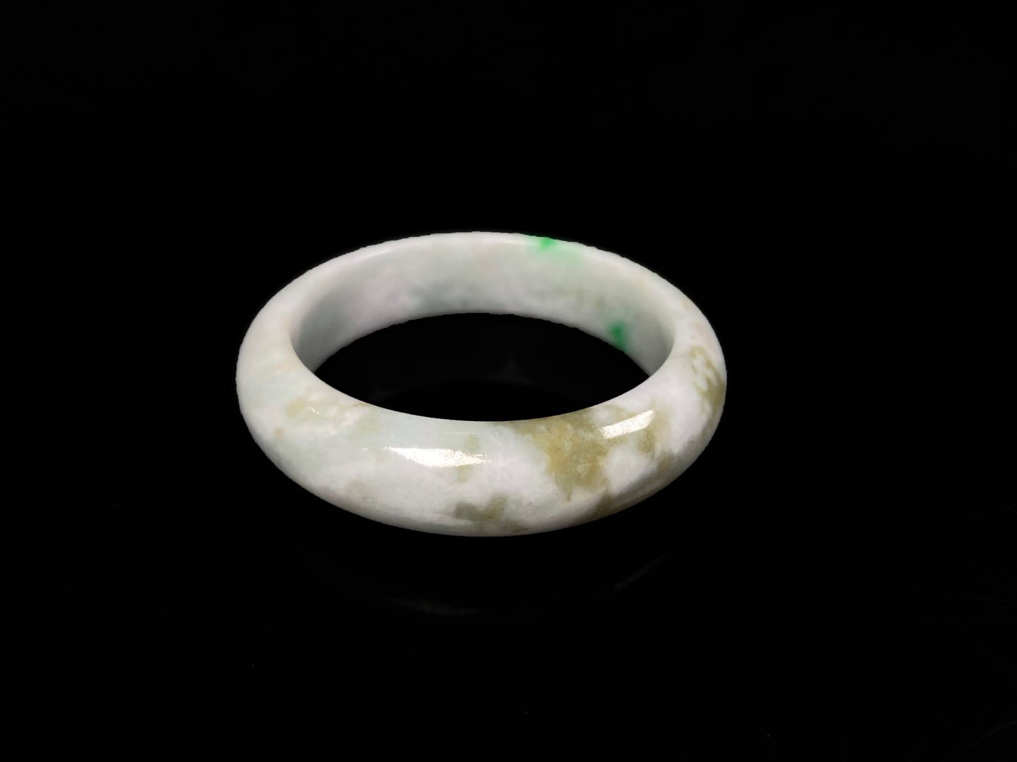 A green sprout jadeite bangle.