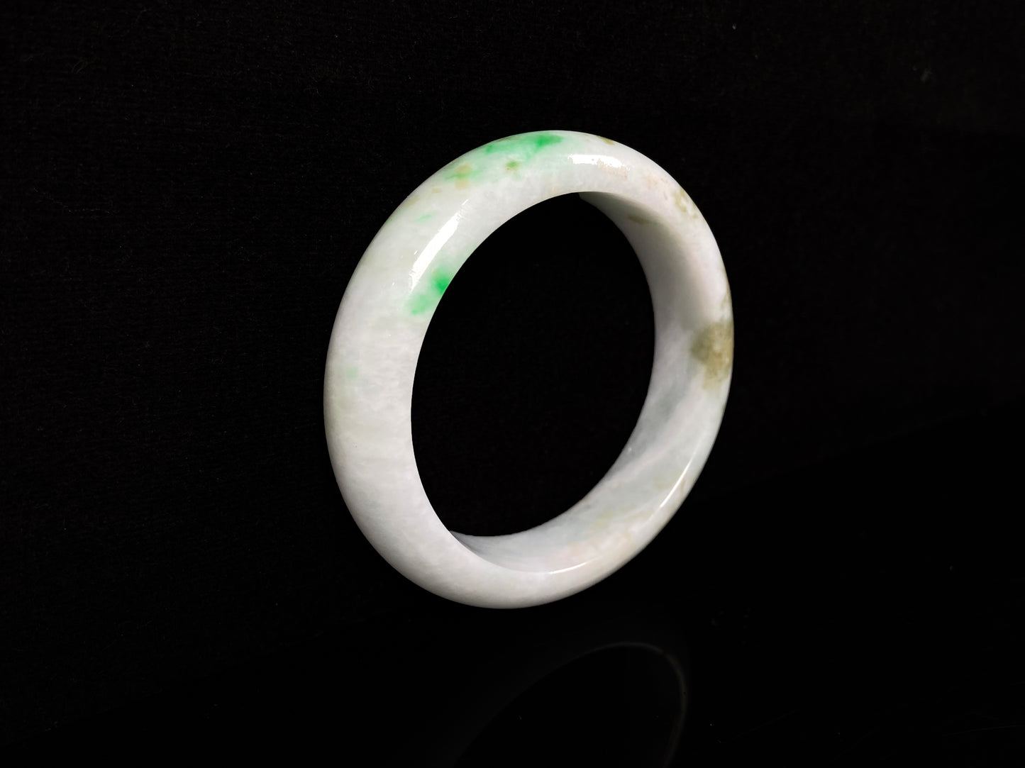 A green sprout jadeite bangle.