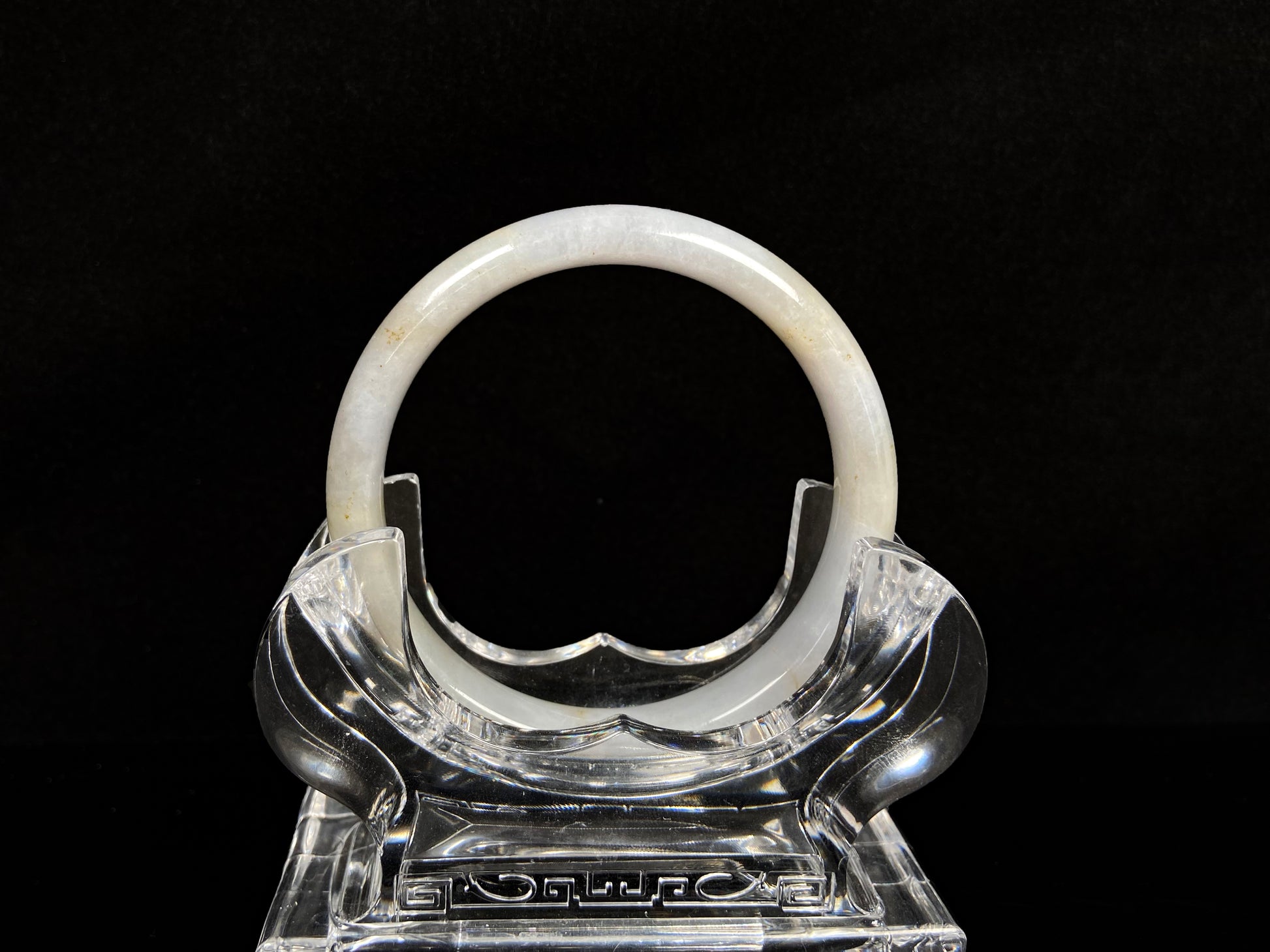 A creamy white with pale yellow  jadeite bangle.