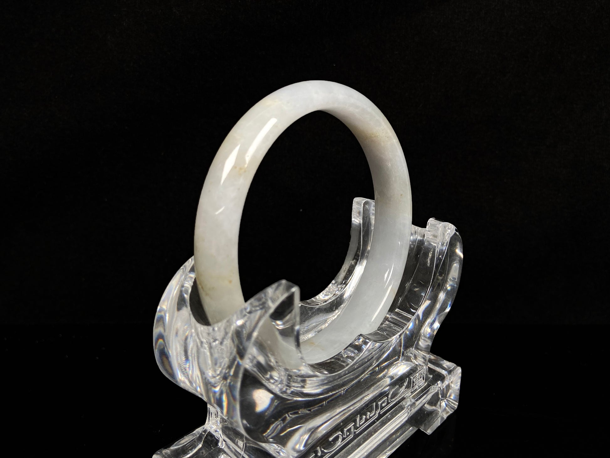 A creamy white with pale yellow  jadeite bangle.