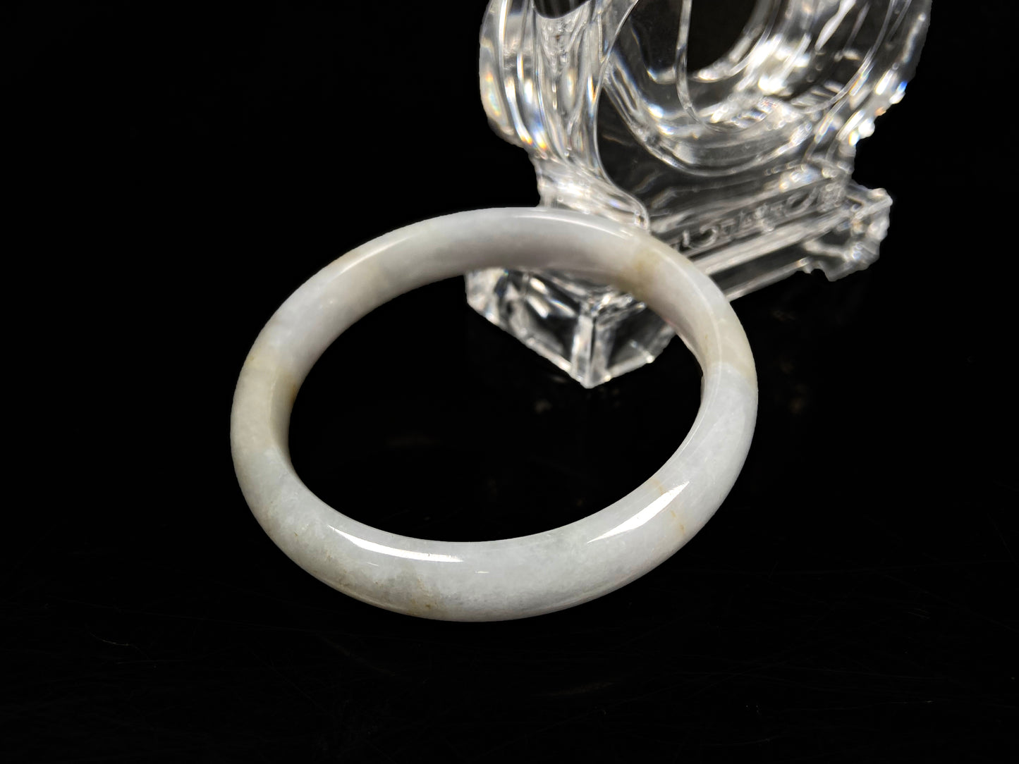 A creamy white with pale yellow  jadeite bangle.