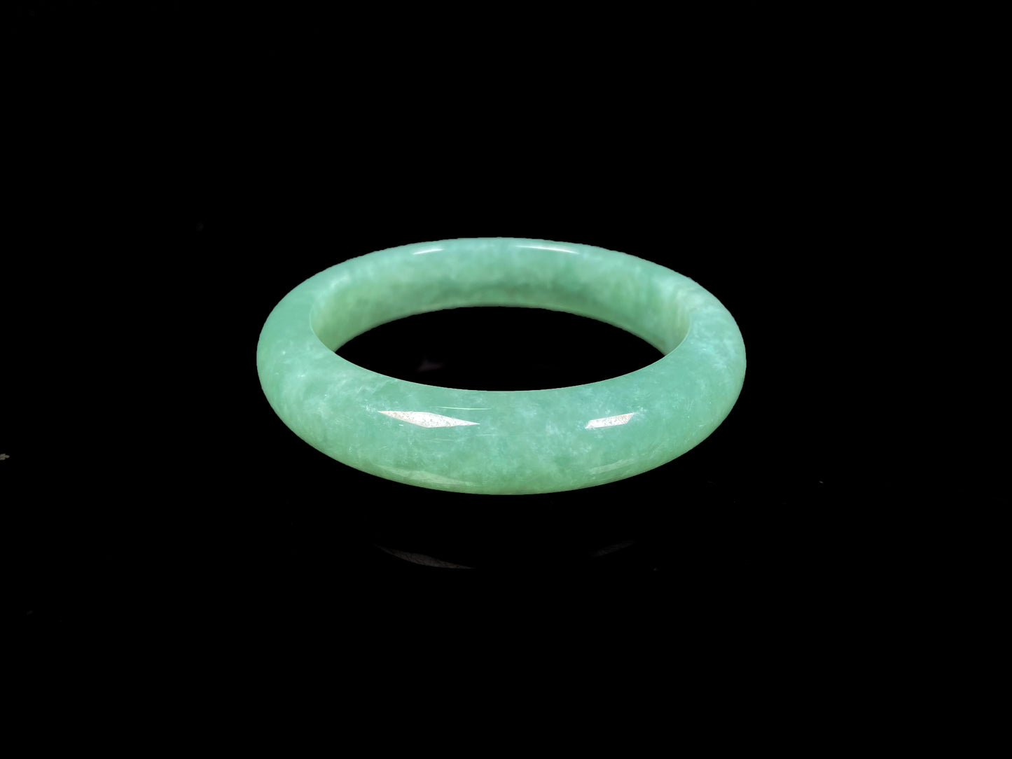 A verdant mist jadeite bangle.