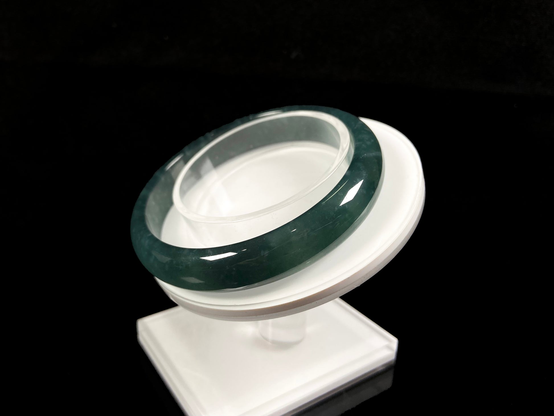 A soft deep blue-green jadeite  bangle.
