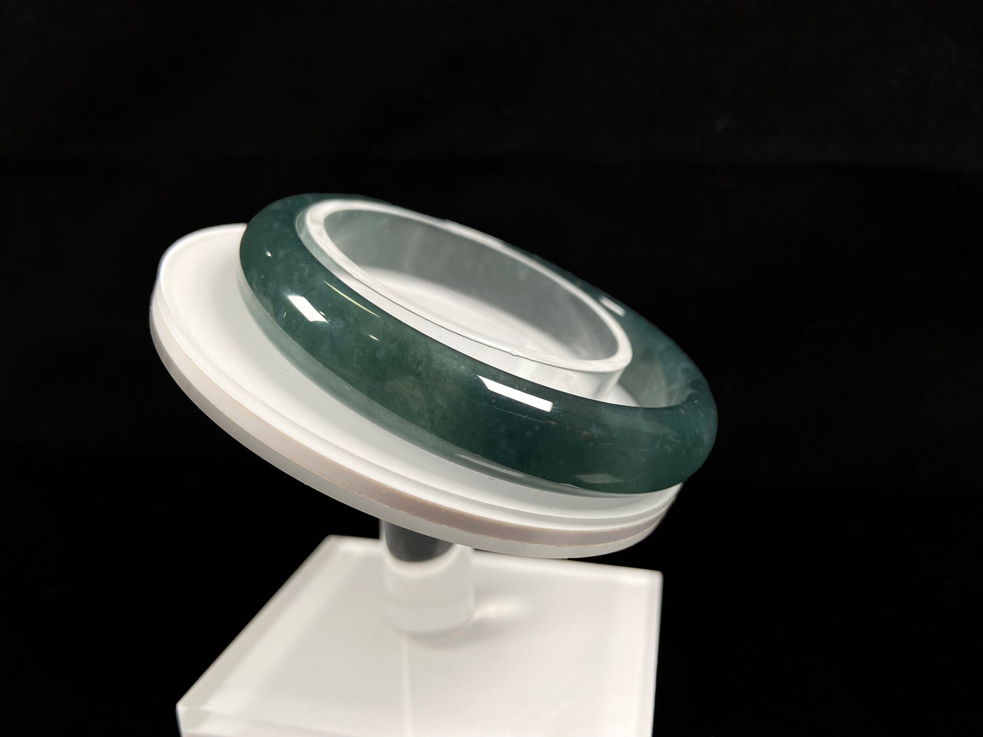 A soft deep blue-green jadeite  bangle.