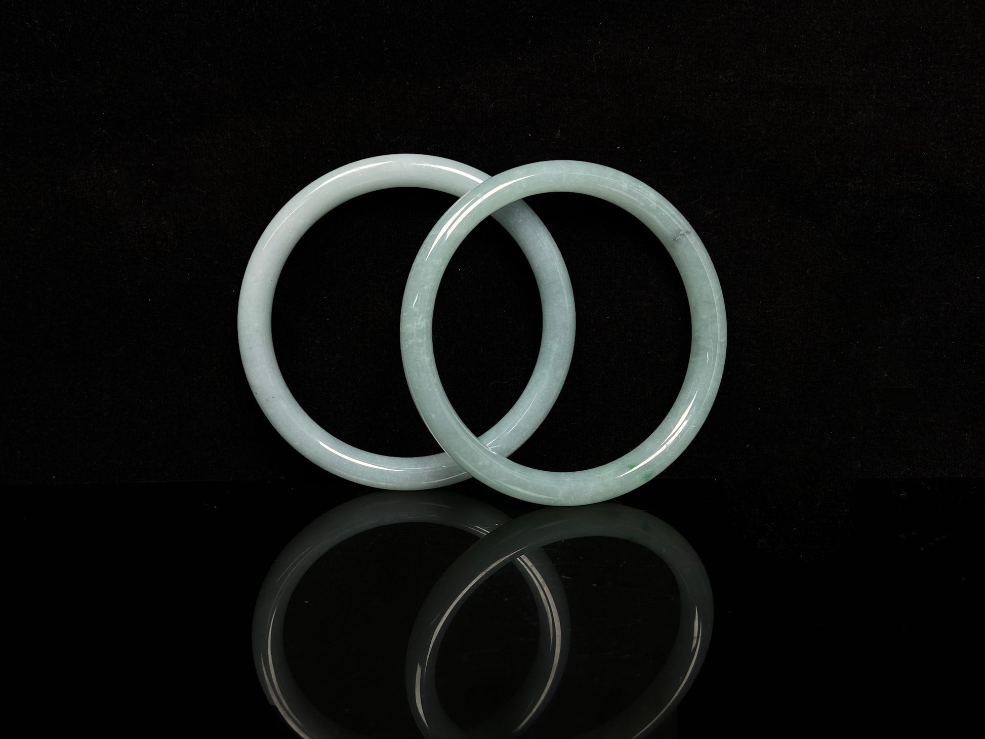 A gentle celadon mist pair jadeite bangle.