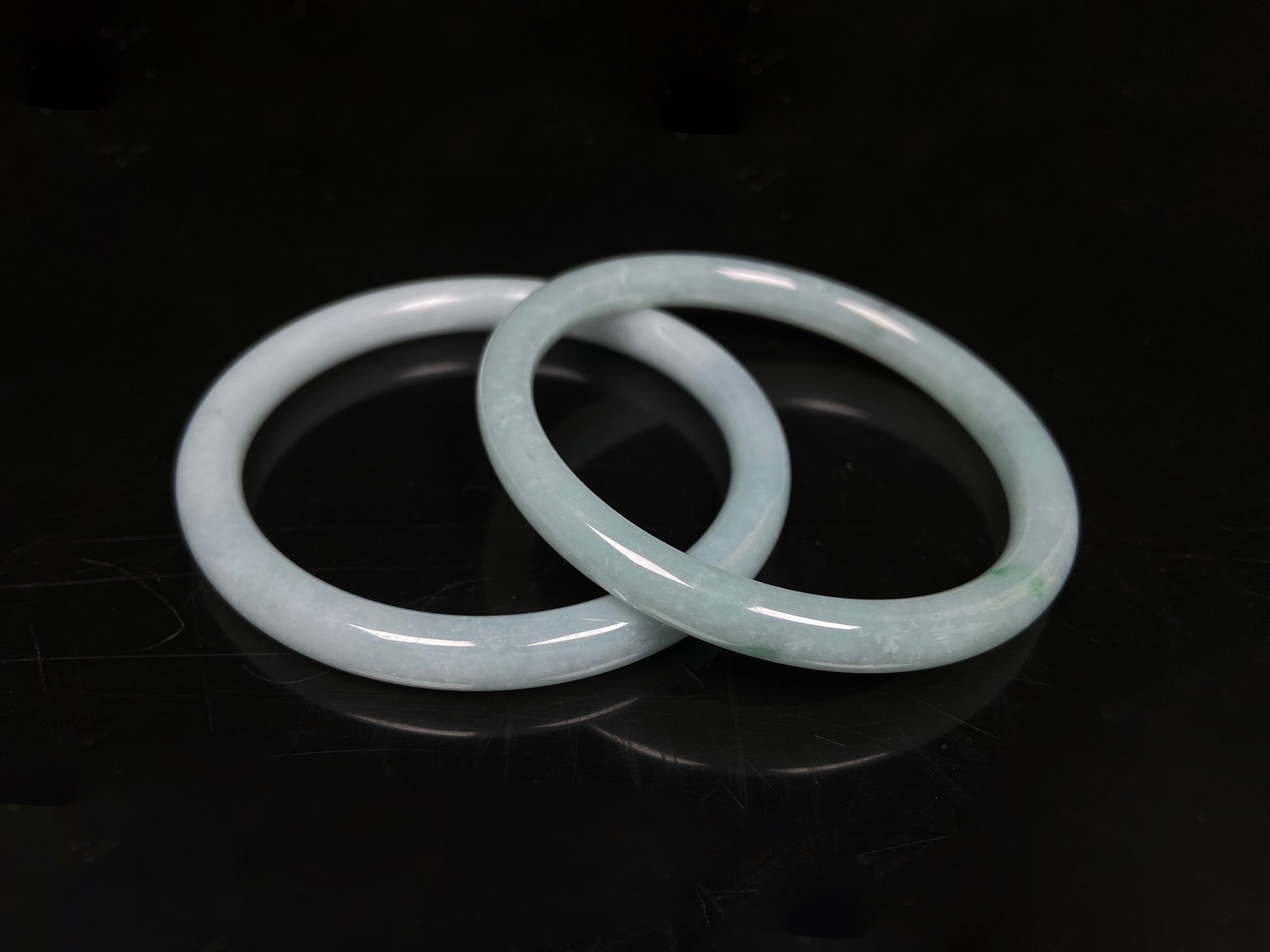 A gentle celadon mist pair jadeite bangle.