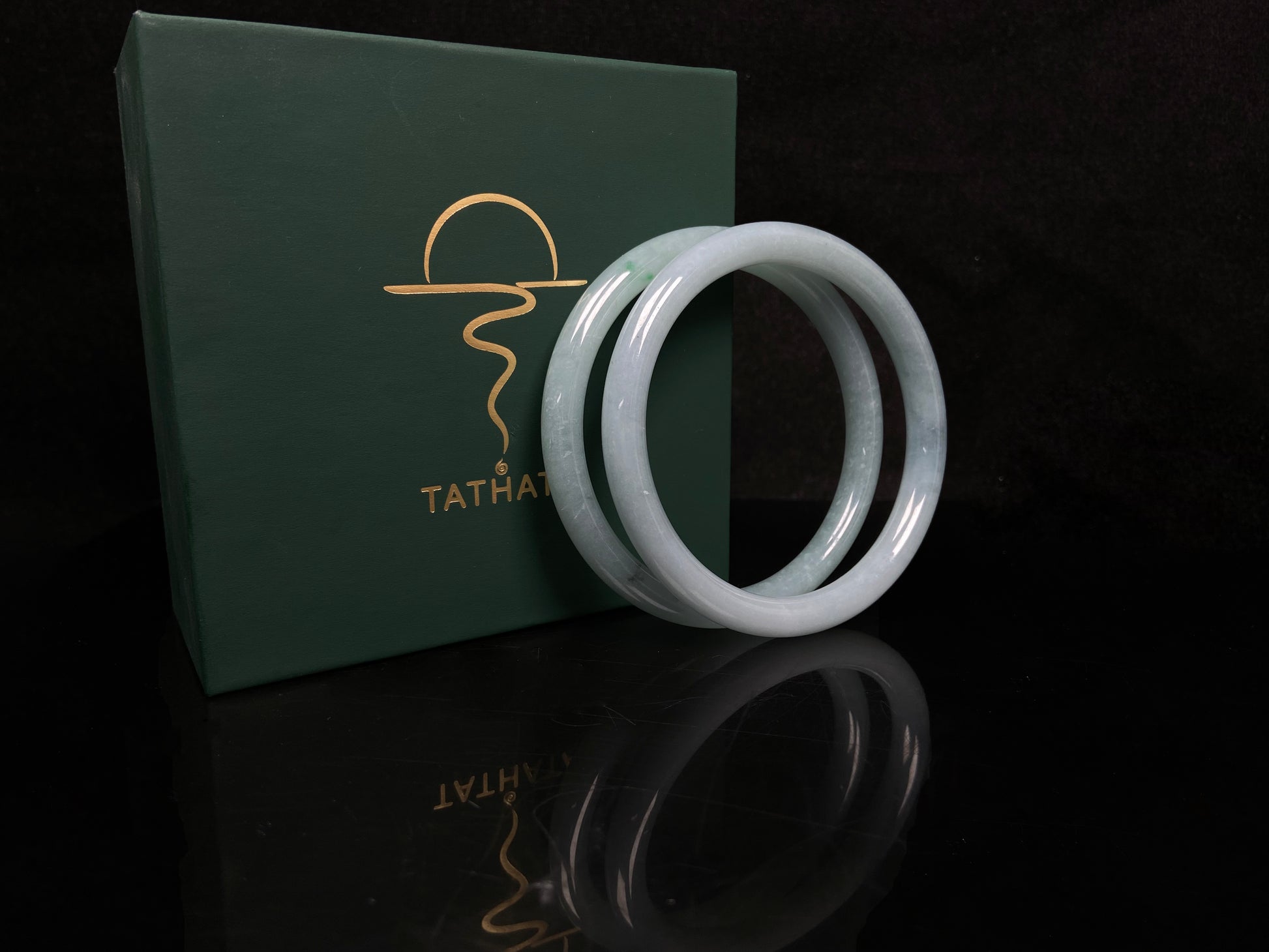 A gentle celadon mist pair jadeite bangle.