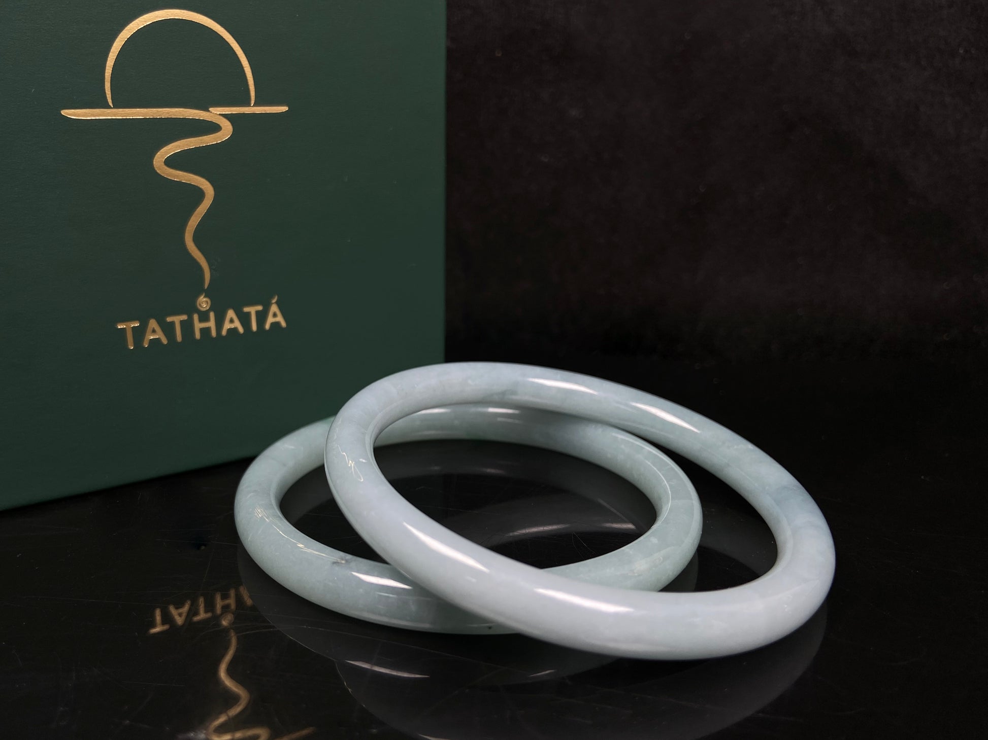 A gentle celadon mist pair jadeite bangle.