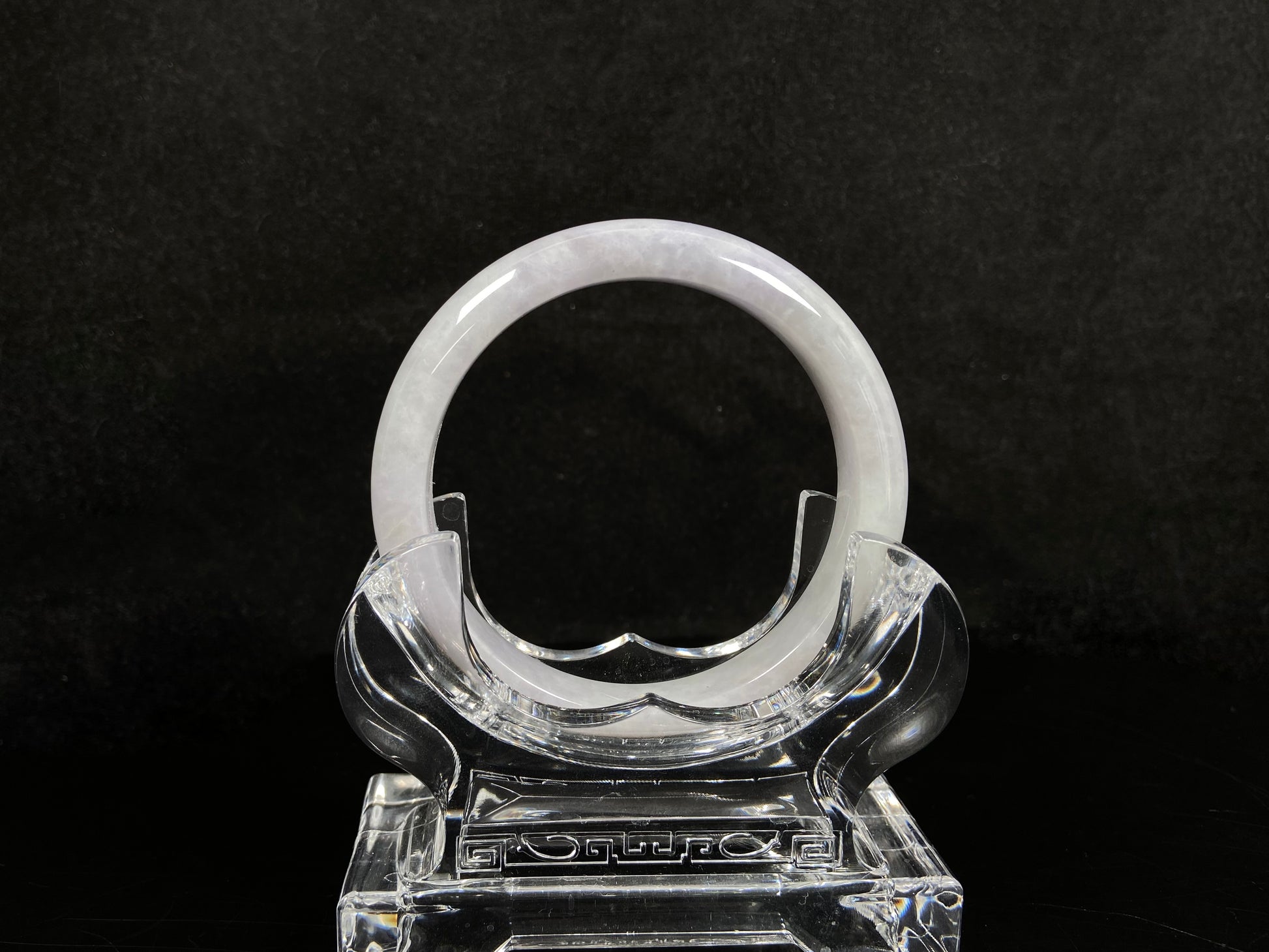 A milky white serenity jadeite bangle.