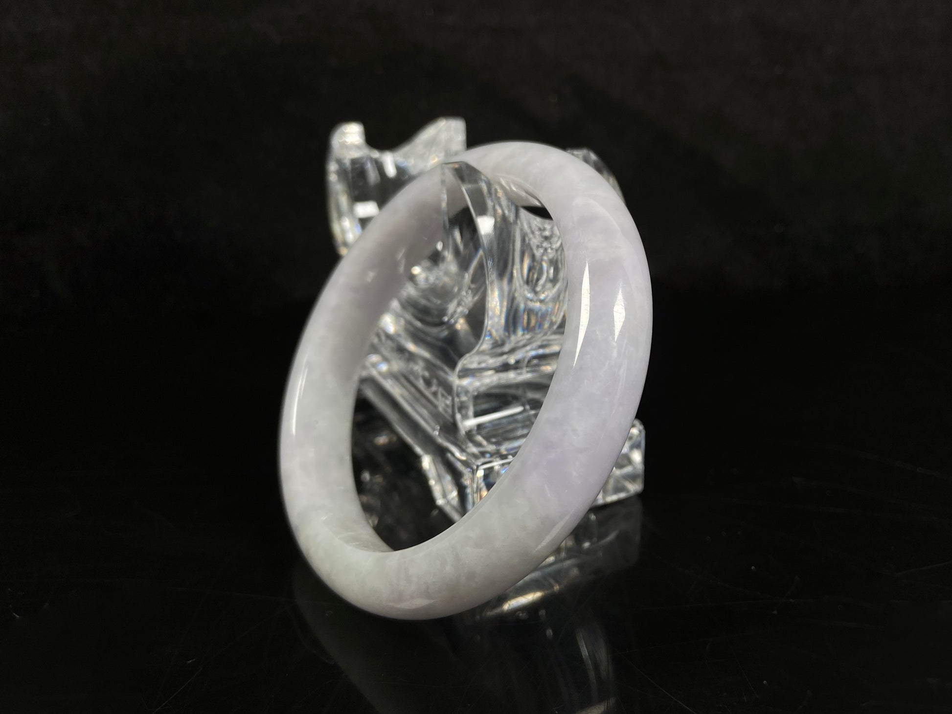 A milky white serenity jadeite bangle.