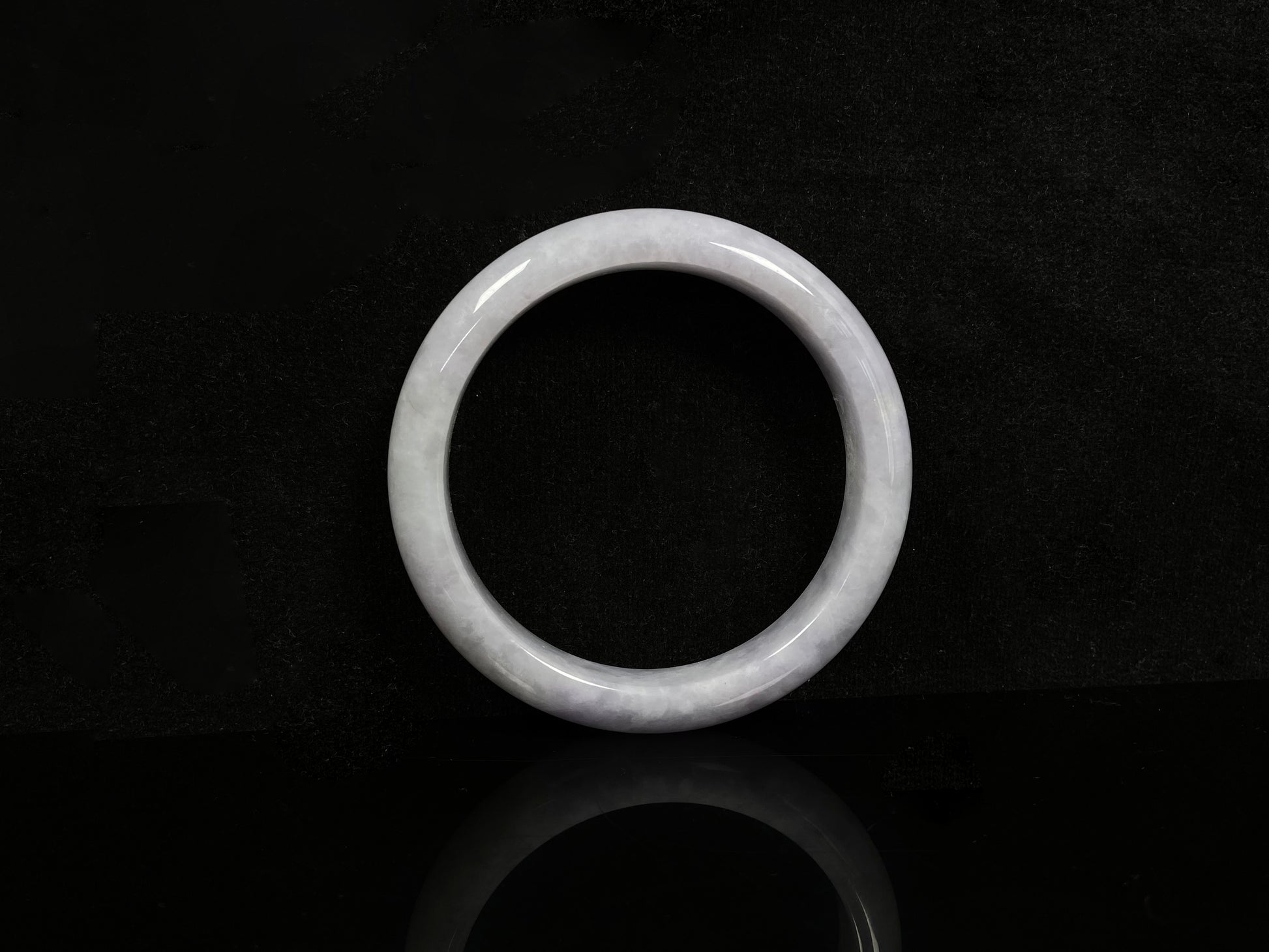 A milky white serenity jadeite bangle.