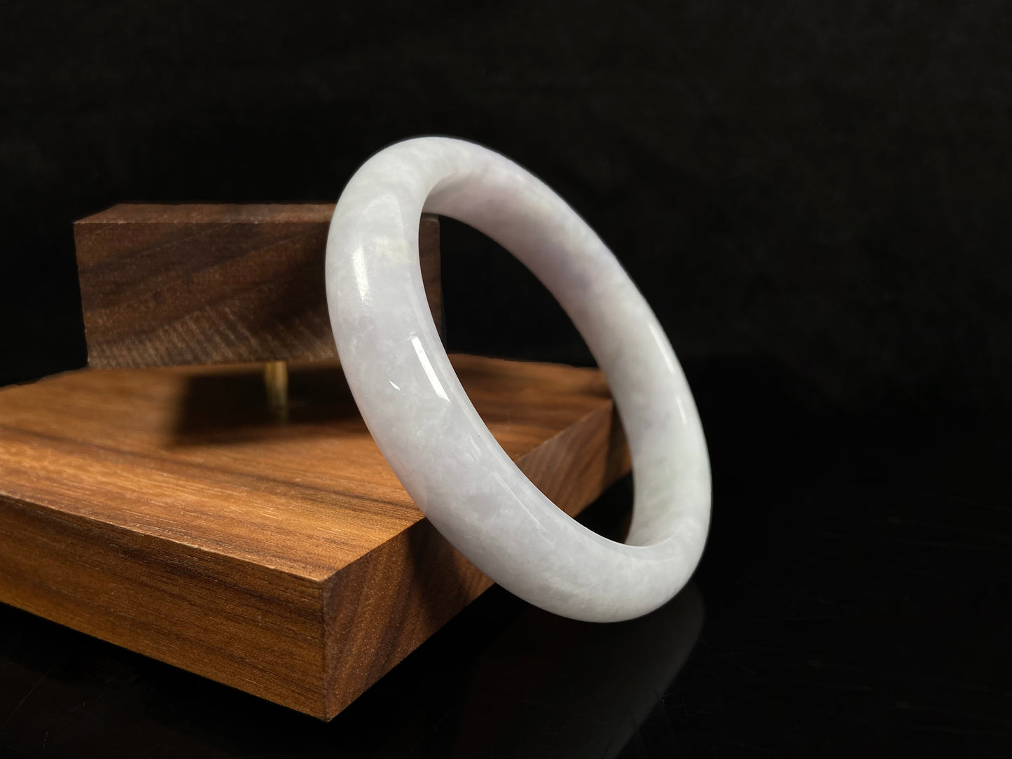 A milky white serenity jadeite bangle.