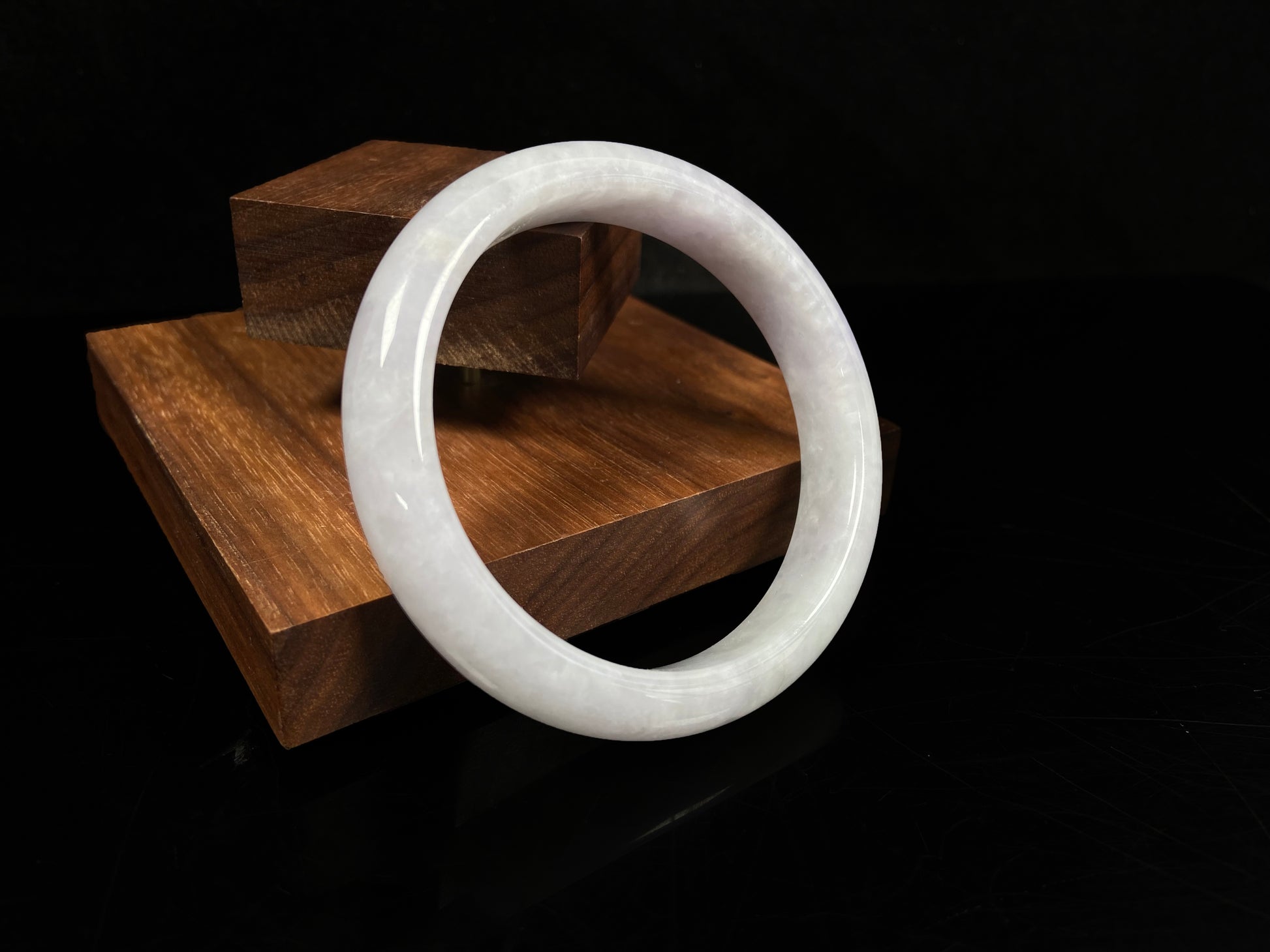 A milky white serenity jadeite bangle.