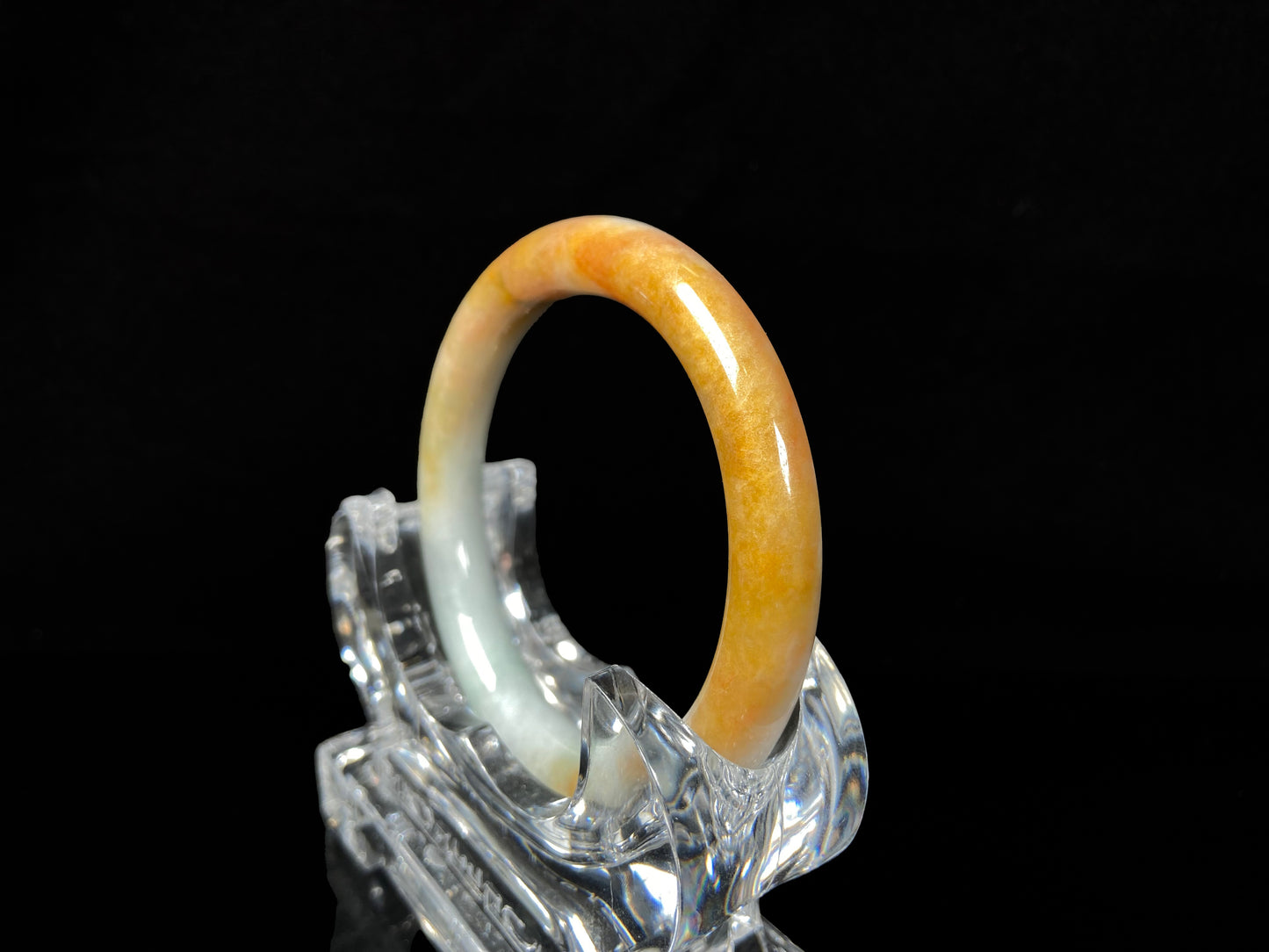 A sunset ice jadeite bangle.