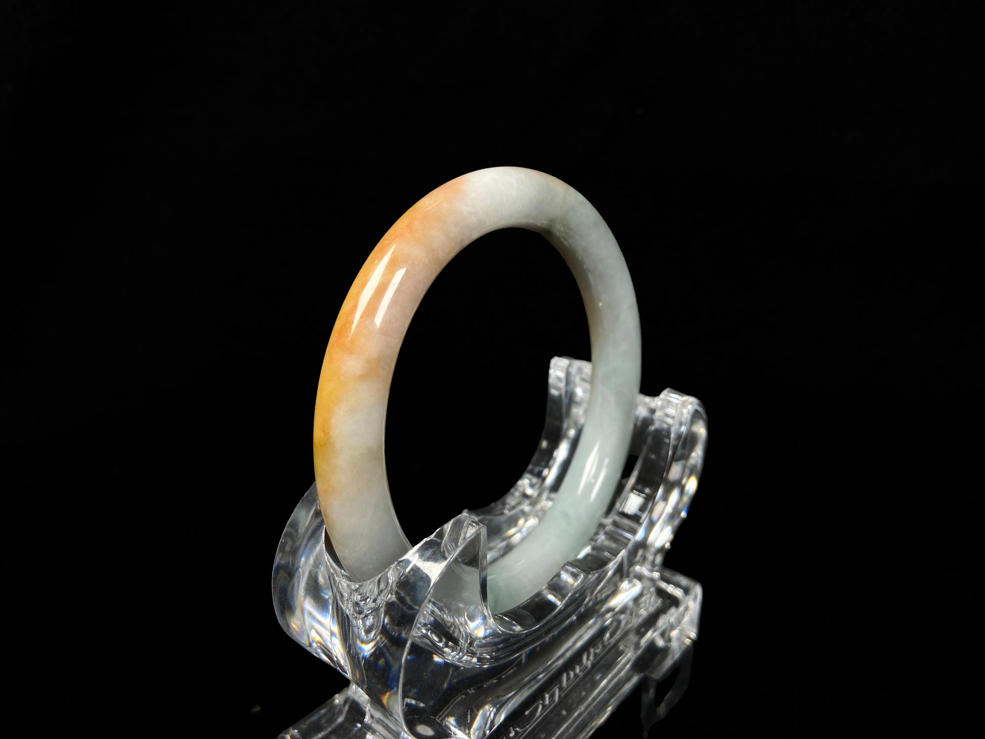 A sunset ice jadeite bangle.