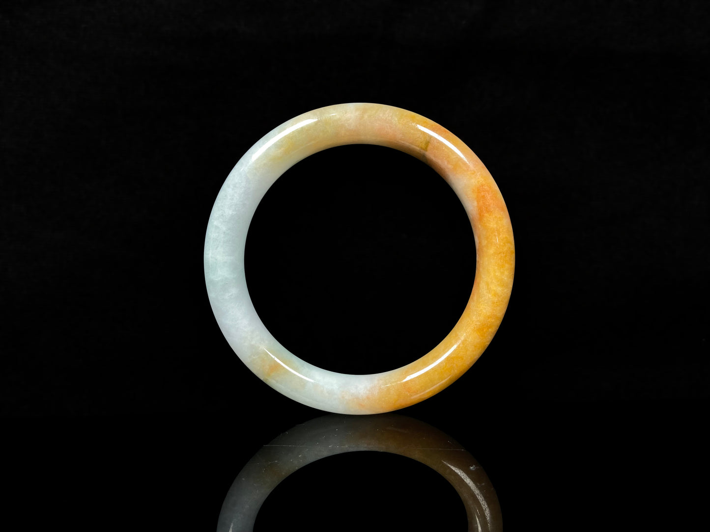 A sunset ice jadeite bangle.