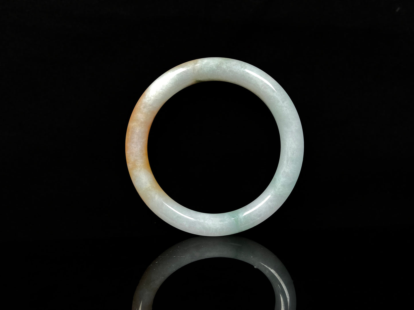 A sunset ice jadeite bangle.
