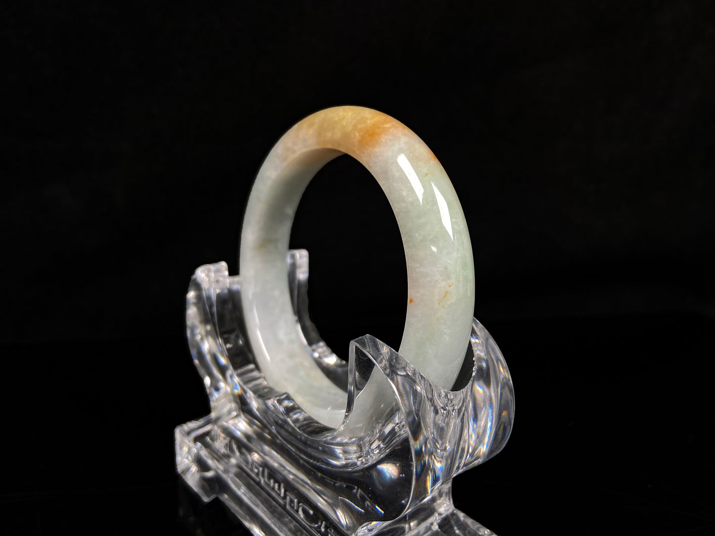 A light fernery gilded mist jadeite bangle.