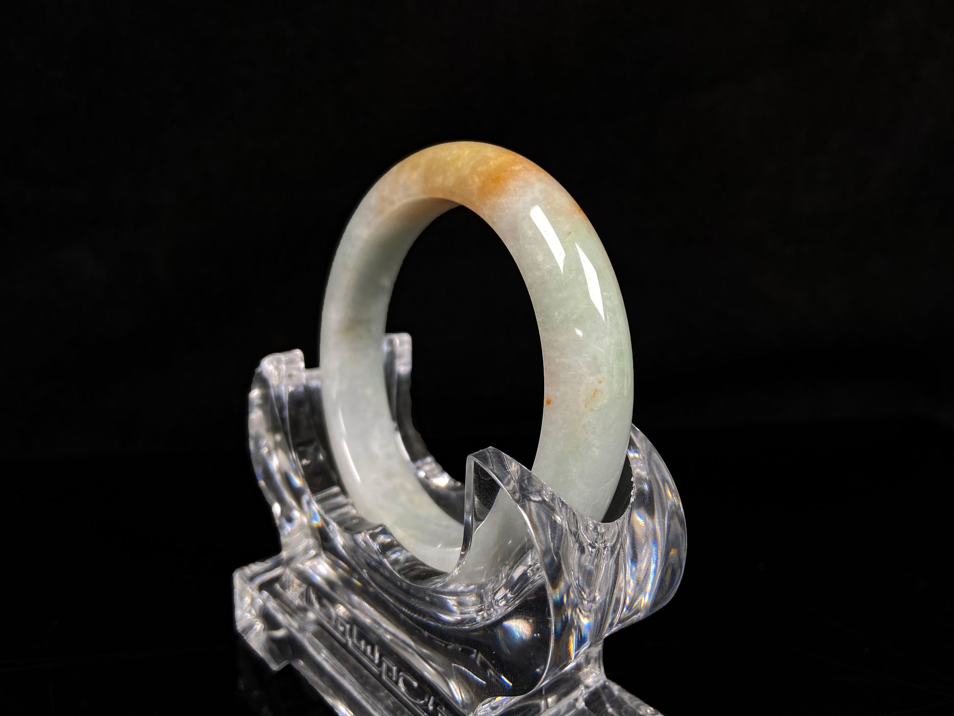 A light fernery gilded mist jadeite bangle.
